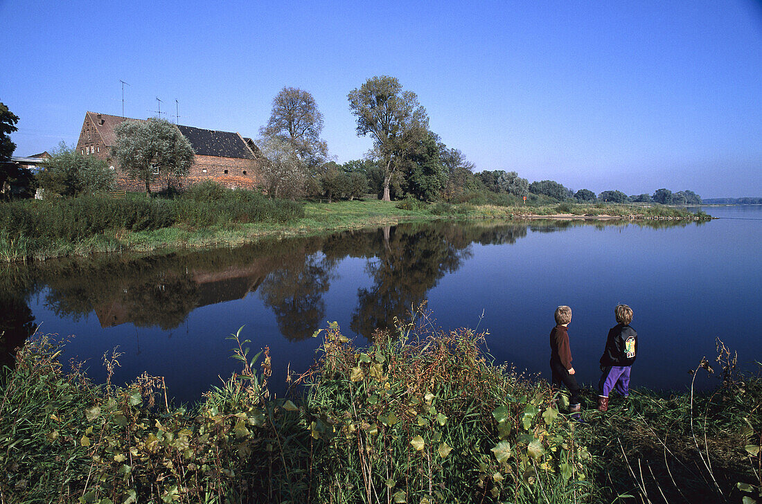 Two boys by river Elbe, near Dessau, Germany