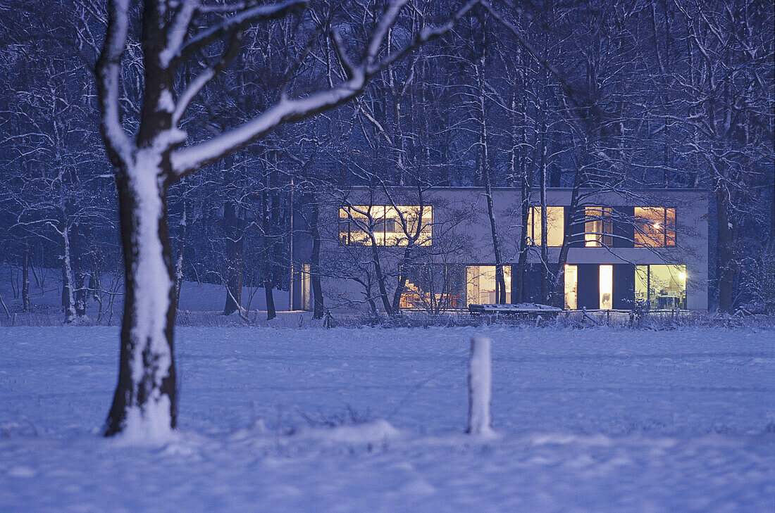 House in rural winter landscape, night, Fischerhude, Lower Saxony, Germany