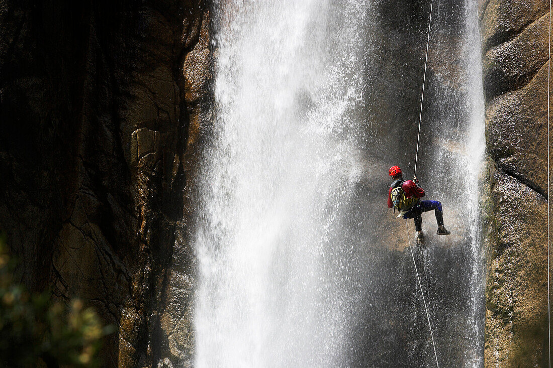 Canyoning, Man abseiling through a waterfall, Corsica Raid, Piscia di Gallu, Ospedale, Corsica, Mediterranean, France