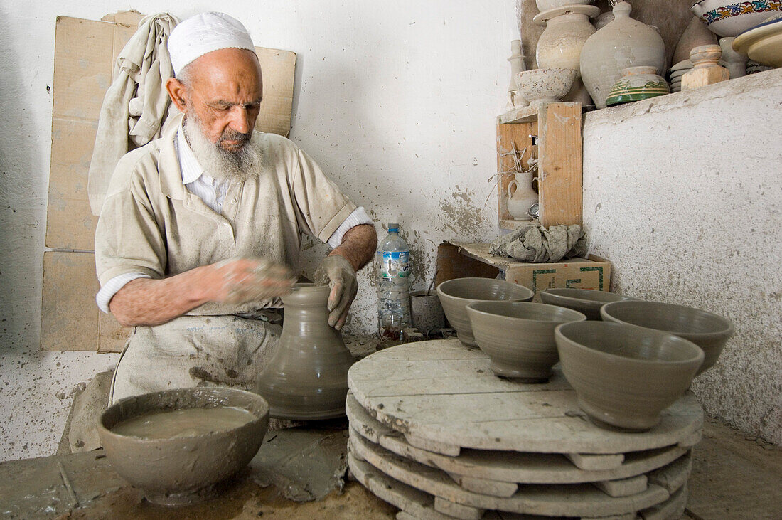 Potter at work in pottery, Fes, Morocco