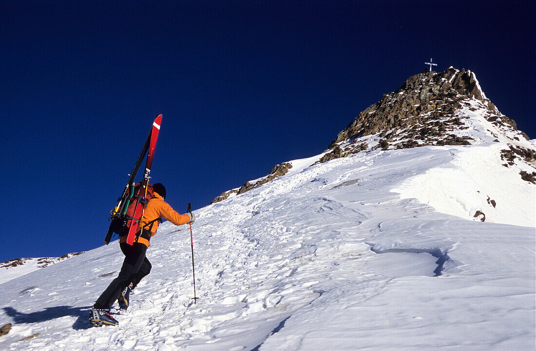 Man on a skitour ascending the summit, Wildspitze, 3768 m, Tyrol, Austria
