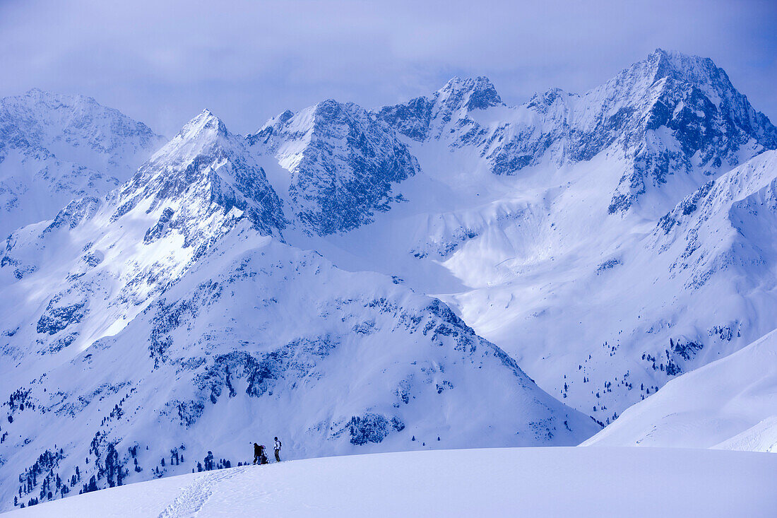 Snowcovered mountain scenery, skier standing in the background, Kuehtai, Tyrol, Austria