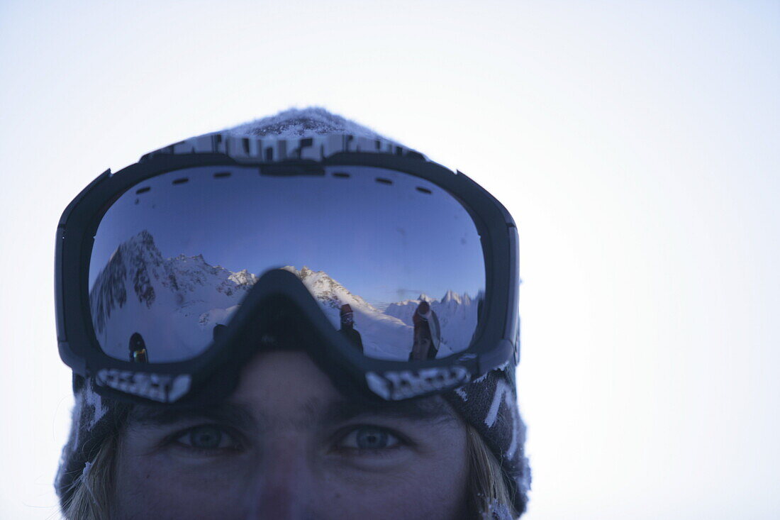 Young man wearing ski googles, portait, Kuehtai, Tyrol, Austria