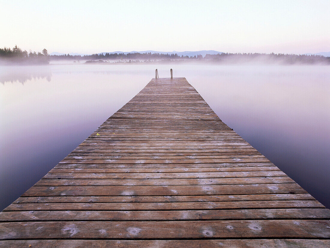 Wooden pier over body of water, Kirchsee, Upper Bavaria, Germany