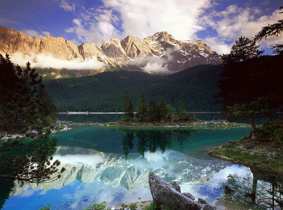 Zugspitze reflecting in lake surface, Eibsee, Upper Bavaria, Germany