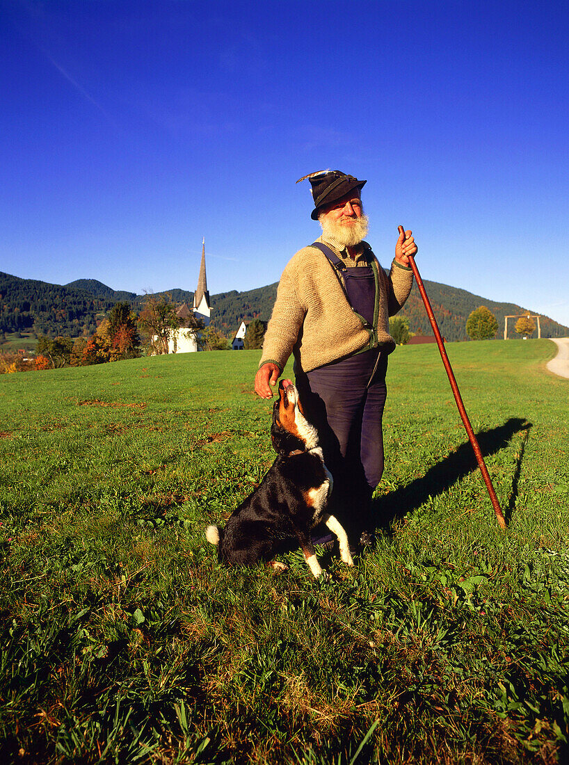 Herdsman with his dog, Ammertal, Upper Bavaria, Germany