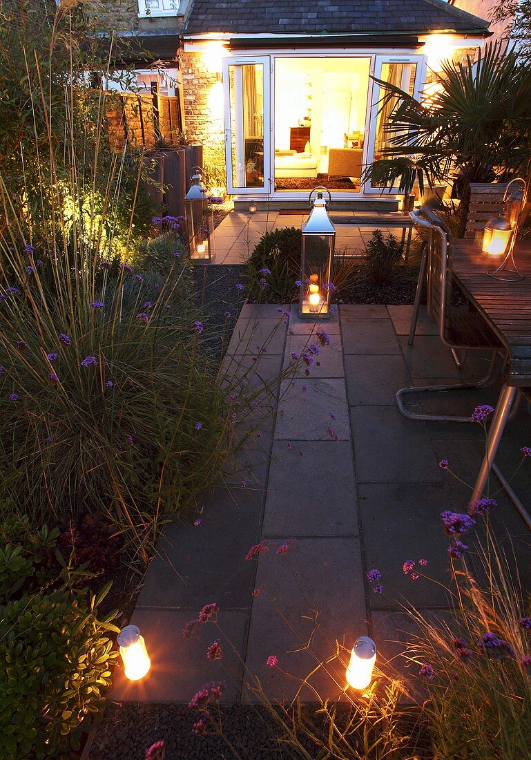 A garden lit with lanterns