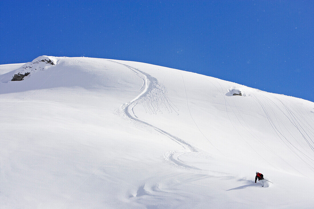 Man skiing downhill, Arlberg, Austria