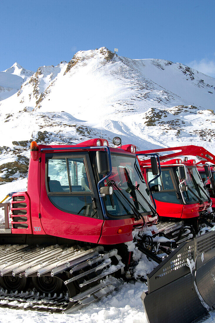 Snowcat in the snow under blue sky, Bad Gastein, Austria