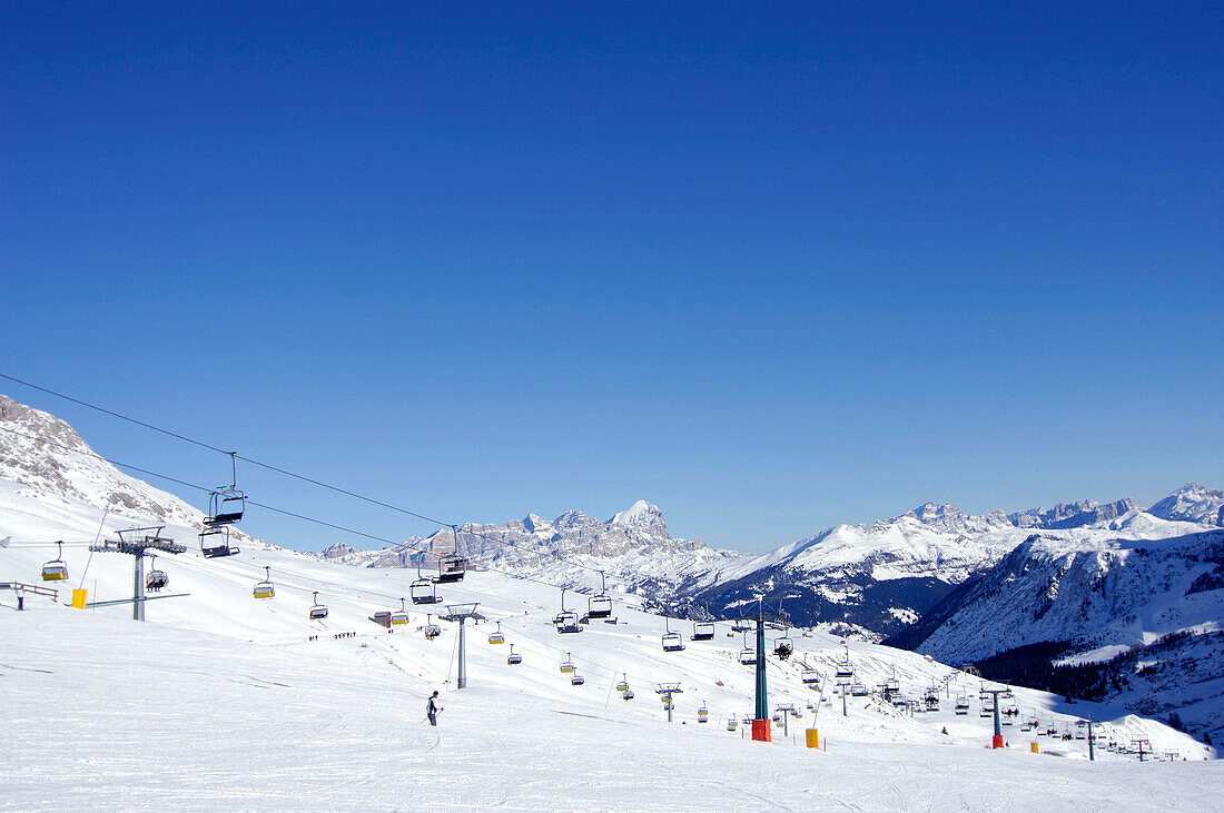 Chair lifts in snow covered landscape, Passo Pordoi, Dolomites, Italy, Europe