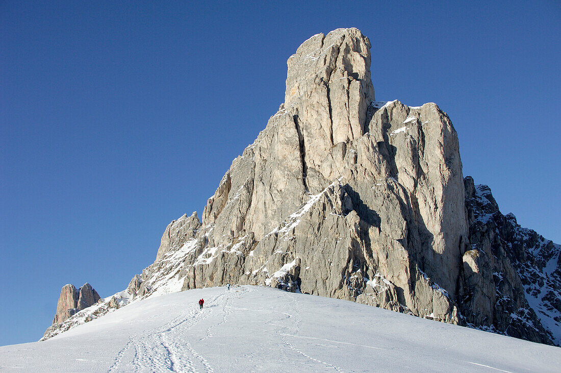 Person hiking through snow, Gruppo della Marmolada, Dolomites, Italy