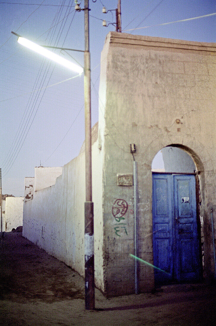 blue door, aswan, egypt