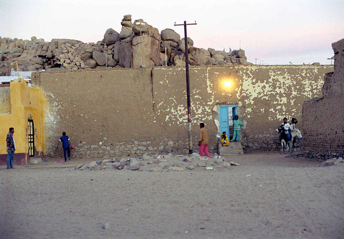 People standing on the street of an egyptian village, Egypt