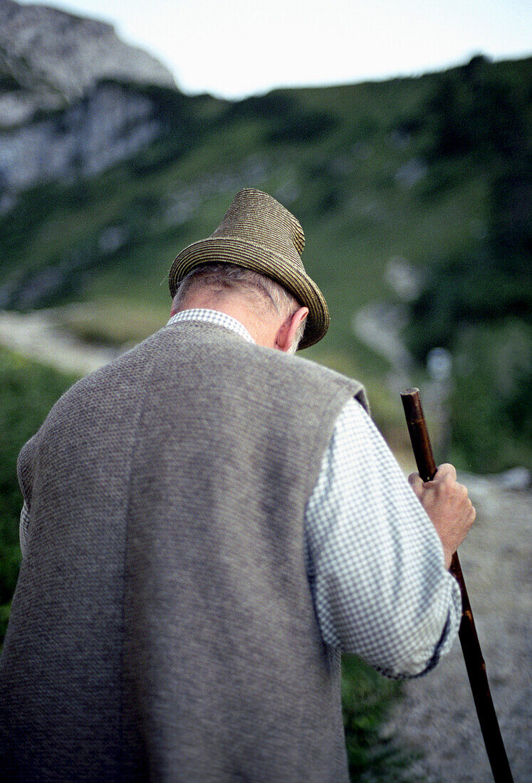 Man with stick, Schachen, Bavaria, Germany