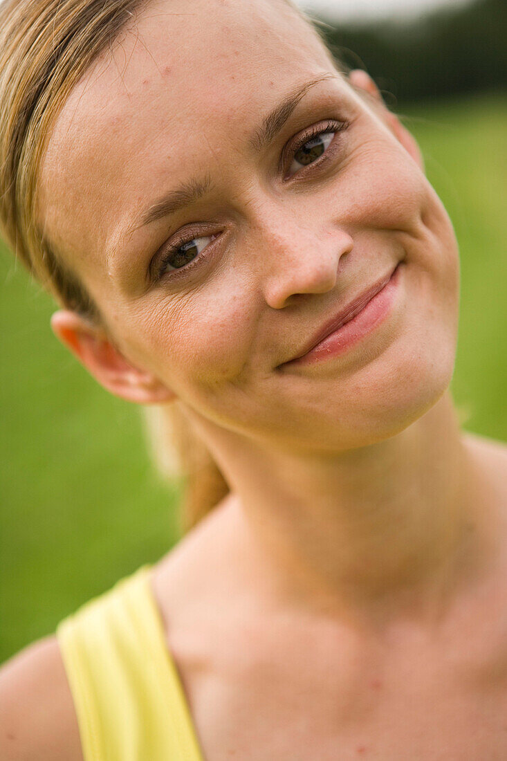 Young woman doing sport smiling at camera
