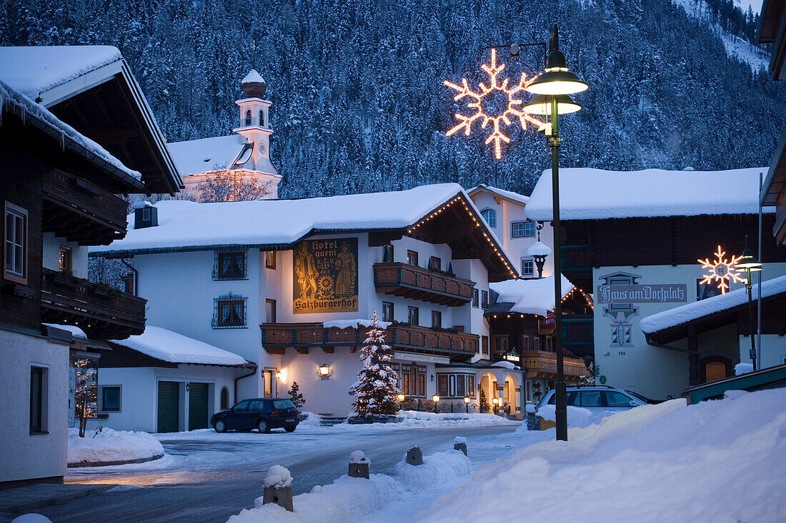View along a street with christmas decoration in the evening, Flachau (927 m), Salzburger Land, Austria