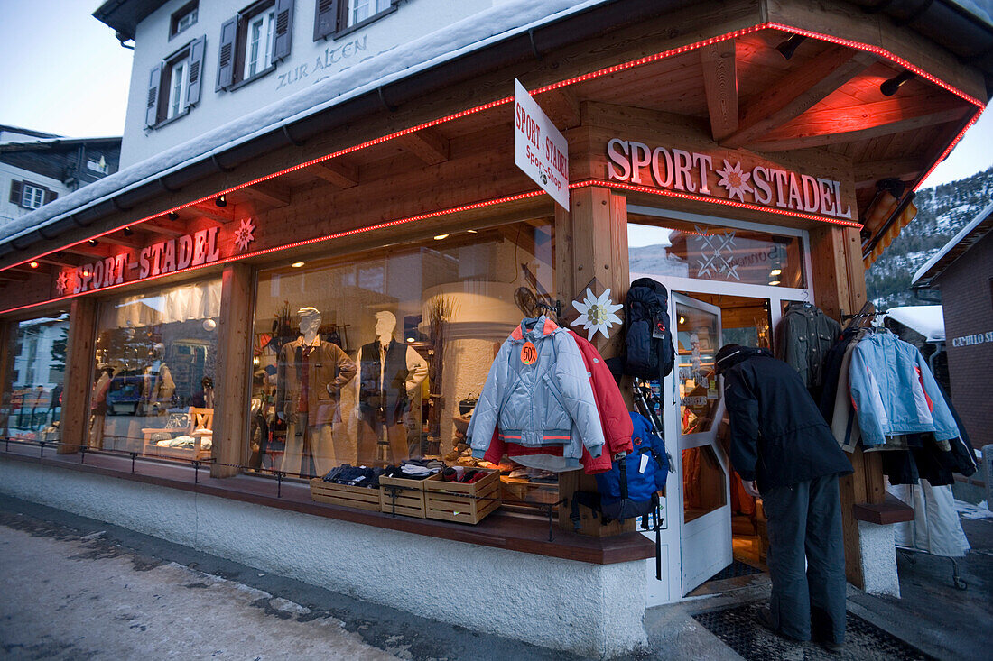 Person entering a sports outfitters, Saas-Fee, Valais, Switzerland