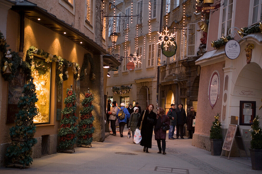 People strolling over the christmassy decorated Waagplatz, Salzburg, Salzburg, Austria