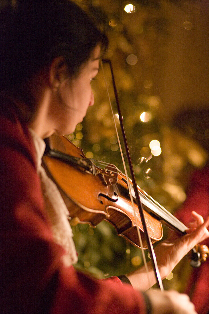 Violinist at the Mozart Dinner Concert in the historic Baroque hall of Stiftskeller St. Peter, founded in 803 and thus the oldest restaurant in Central Europe, is one of the musical and culinary tempations, Salzburg, Salzburg, Austria