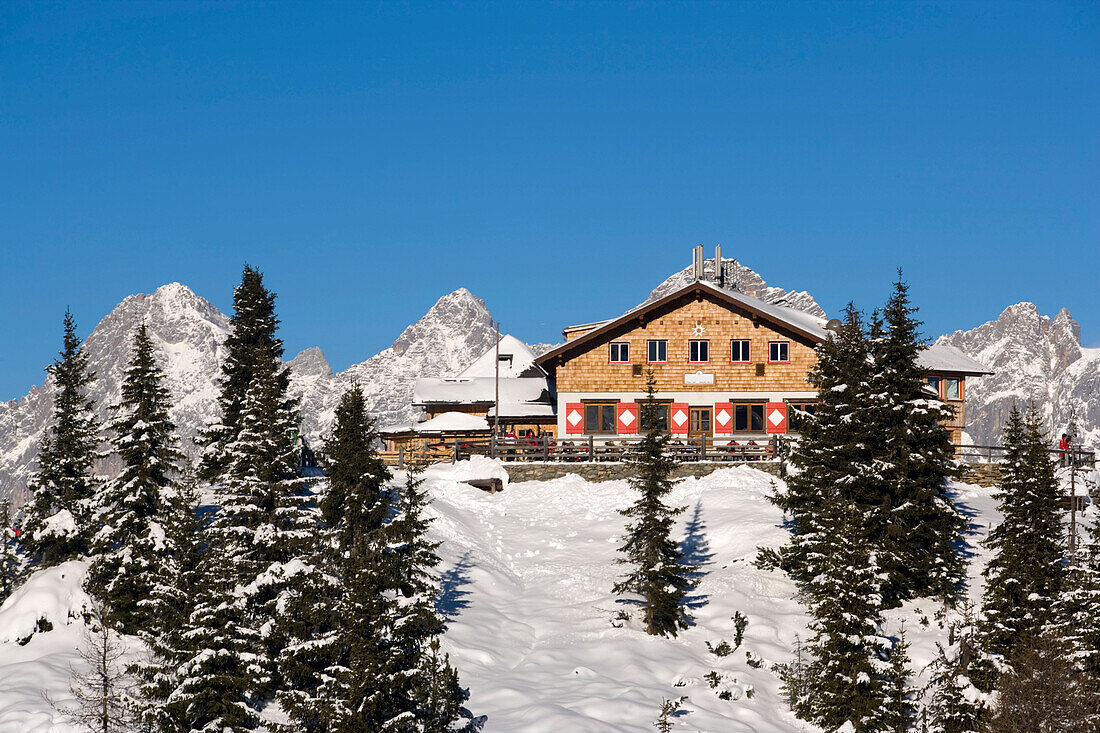 Snowy hill with ski lift station, summit of Dachstein Mountains at horizon, Hochwurzen, Schladming, Ski Amade, Styria, Austria