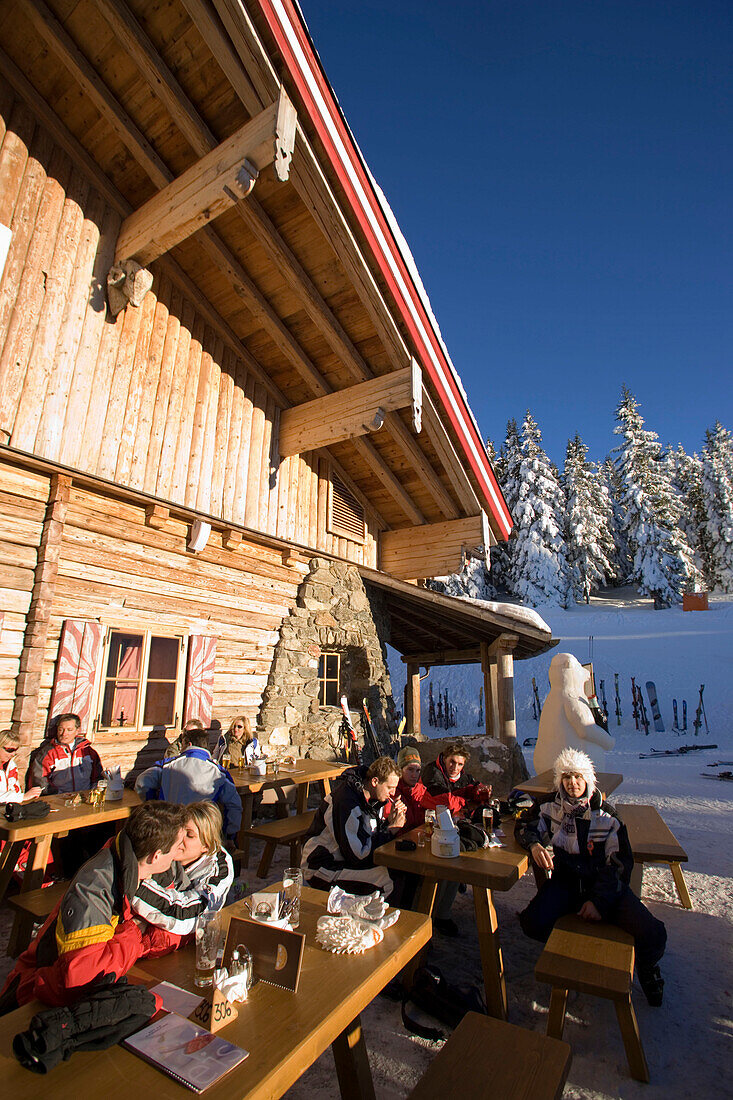 People resting in front of mountain restaurant, Planai, Schladming, Ski Amade, Styria, Austria