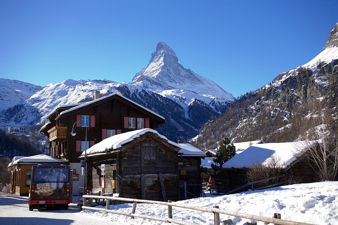 Bus at bus stop, Zermatt village with the Matterhorn (4478 metres) in the background, Zermatt, Valais, Switzerland