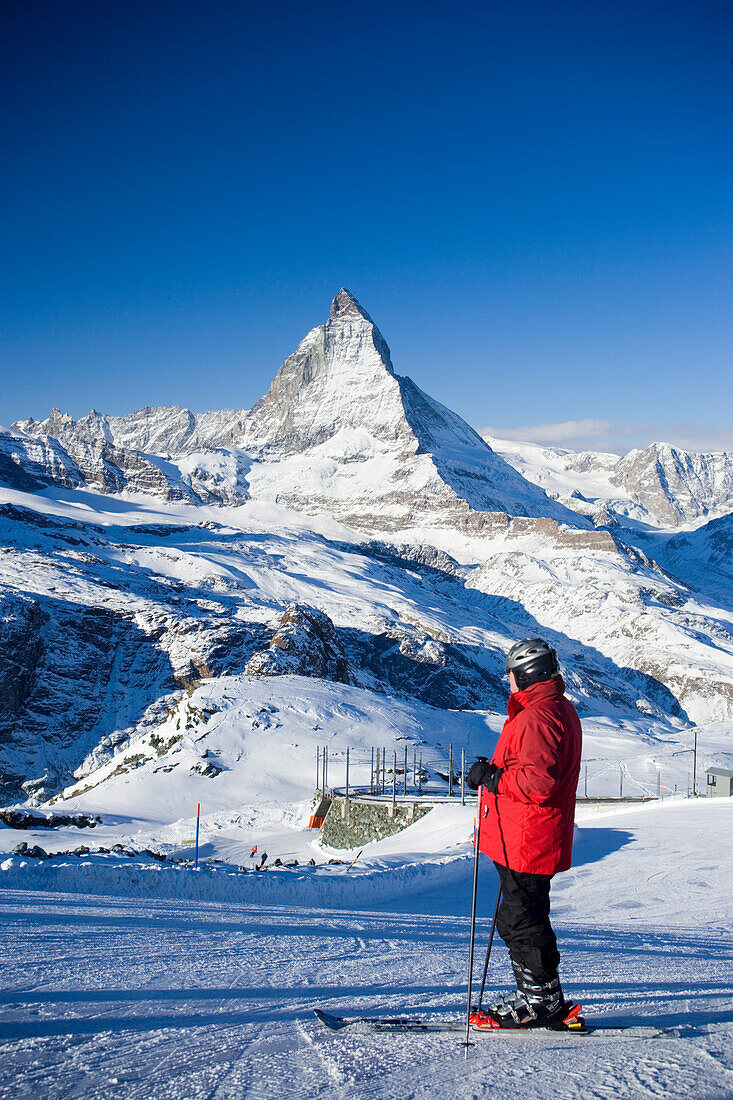 Skier on mountain slope, Matterhorn (4478 m) in background, Zermatt, Valais, Switzerland