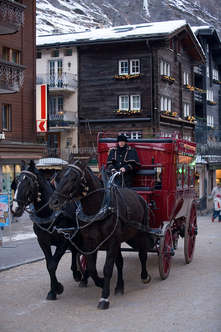 A carriage passing a street in Zermatt, Valais, Switzerland