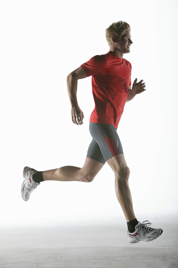 Runner, young man (20-25y) in motion