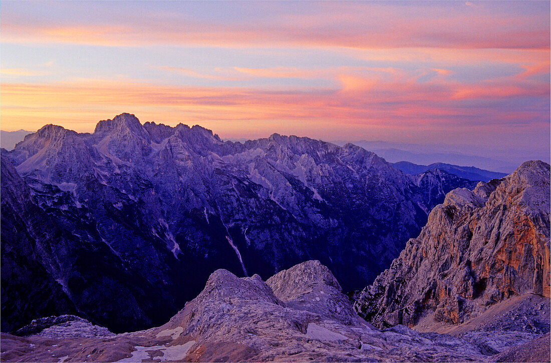 Romantic sunset sky and alpenglow, view from the hut Kredarica or Triglavski Dom, Triglav Nationalpark, Julian Alps, Slovenia, Alps.