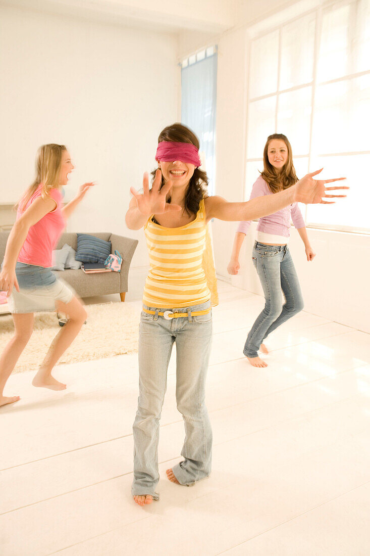 Teenage girls (14-16) playing Blind Man's Bluff