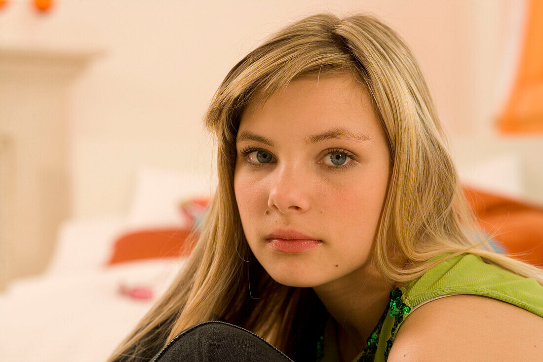 Teenage girl (14-16) looking at camera, portait