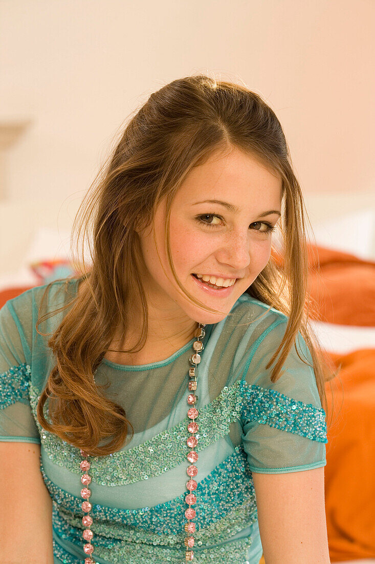 Teenage girl (14-16) smiling, portait