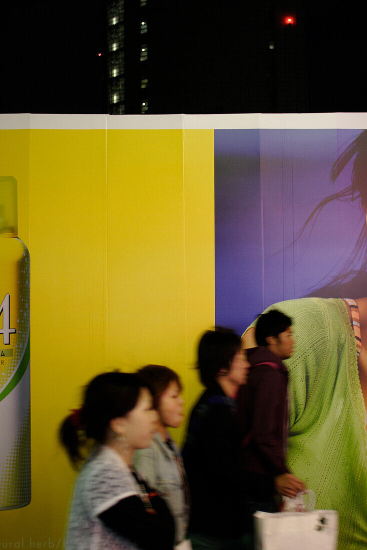 Young people in front of a fashion billboard, Harajuku, Takeshita-Dori, Tokyo, Japan