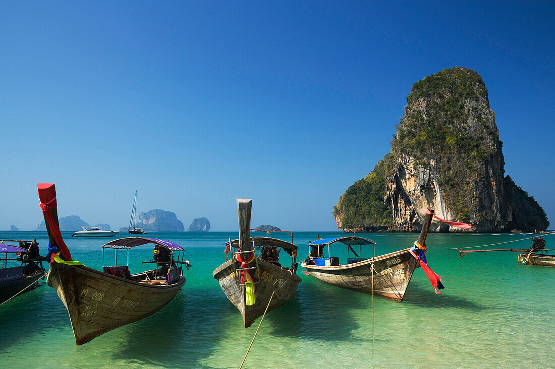 Anchored boats, chalk cliff in background, Phra Nang Beach, Laem Phra Nang, Railay, Krabi, Thailand, after the tsunami