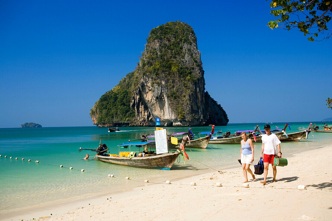 People, Trips offered, Anchored boats, chalk cliff in background, Phra Nang Beach, Laem Phra Nang, Railay, Krabi, Thailand, after the tsunami