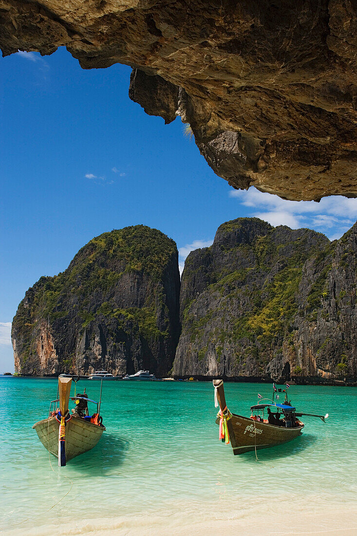 Two boats anchoring in the Maya Bay, a beautiful scenic lagoon, famous for the Hollywood film "The Beach", Ko Phi-Phi Leh, Ko Phi-Phi Islands, Krabi, Thailand, after the tsunami