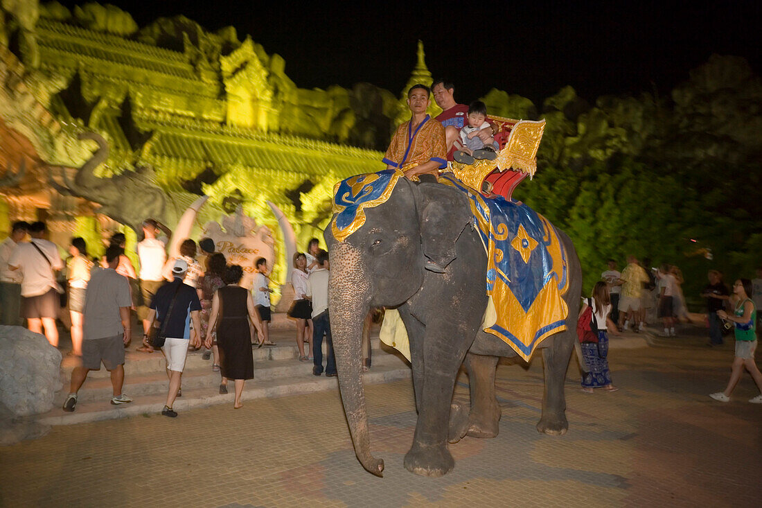 Tourists riding on a elephant, Palace of the Elephants, Phuket Fantasea, Nighttime Cultural Theme Park, Kamala Beach, Phuket, Thailand