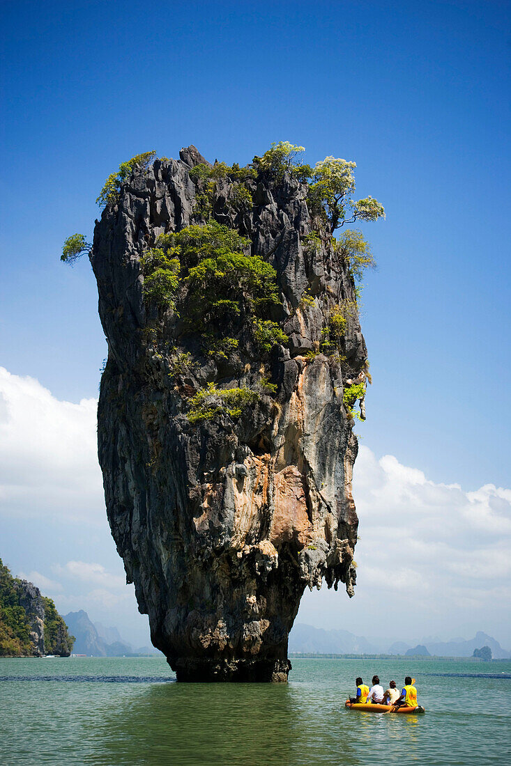 View to Koh Tapu, so-called James Bond Island, The Man with the Golden Gun, people in a boat in foreground, Ko Khao Phing Kan, Phang-Nga Bay, Ao Phang Nga Nation Park, Phang Nga, Thailand