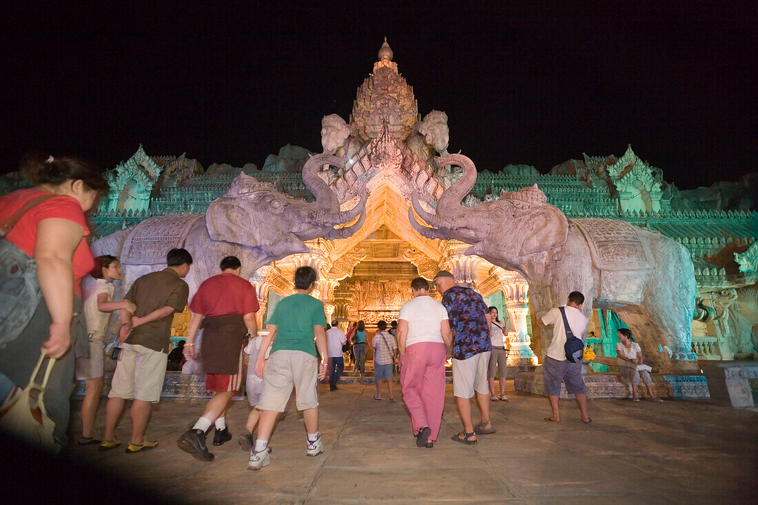 People walking through entrance of Palace of the Elephants, Phuket Fantasea, Nighttime Cultural Theme Park, Kamala Beach, Phuket, Thailand