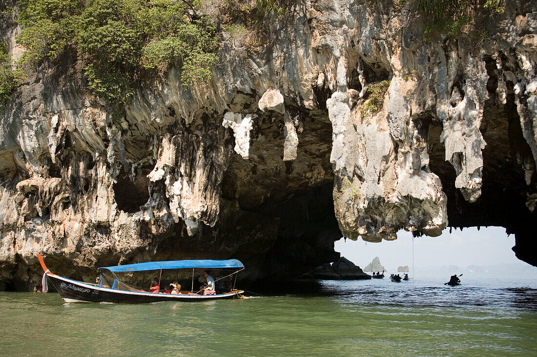 Boat passing a Karst formation, Phang-Nga Bay, Ao Phang Nga Nation Park, Phang Nga, Thailand