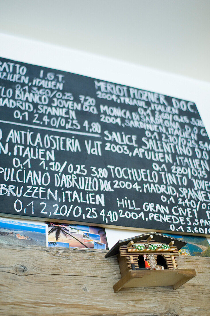 Recommendations for wine on chalkboard and cuckoo clock, Loretta Bar, Munich