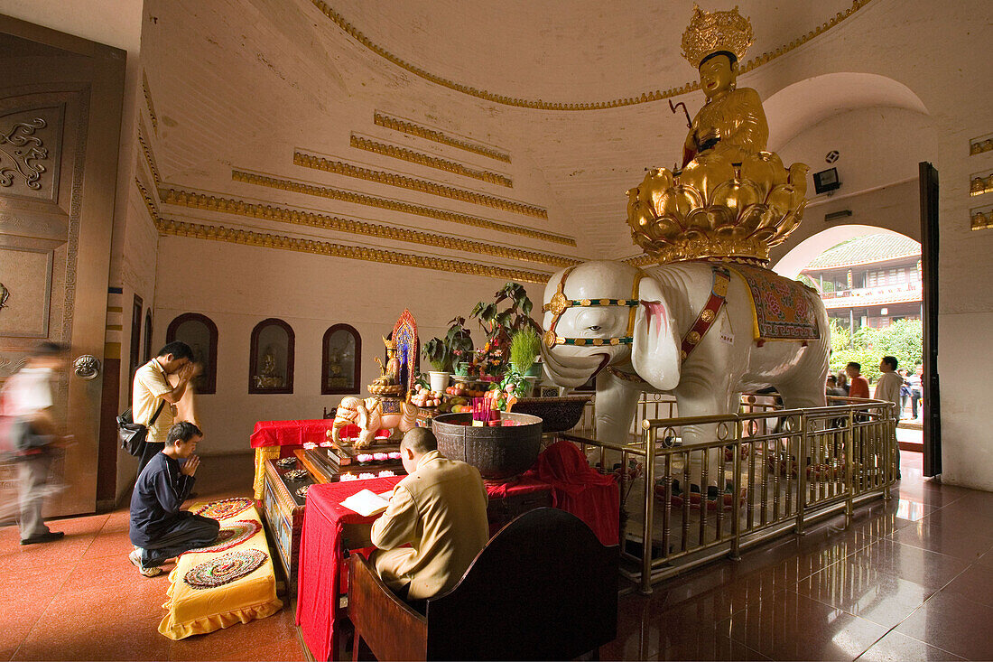 Wannian Monastery and temple, brick hall with Buddha riding white elephant, pilgrims, Sichuan Province, Emeishan, Mount Emei, World Heritage, UNESCO, China, Asia