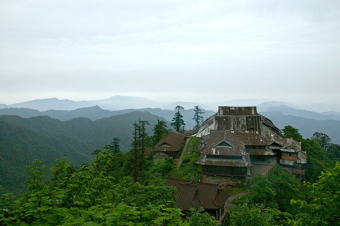view over corrugated iron roofs of the Xixiang Chi monastery and temple, forest green, Elephant Bathing Pool, World Heritage Site, UNESCO, China, Asia