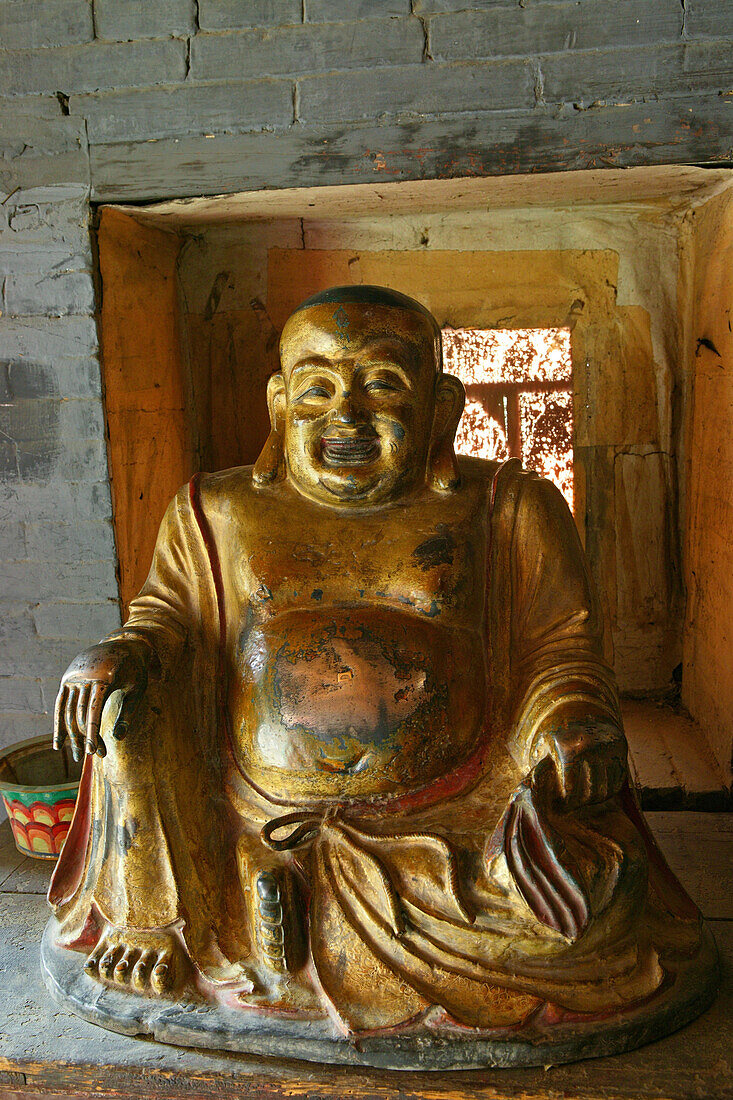 Gilded Buddha statue at the entrance of hanging monastery, Heng Shan North, Shanxi province, China, Asia