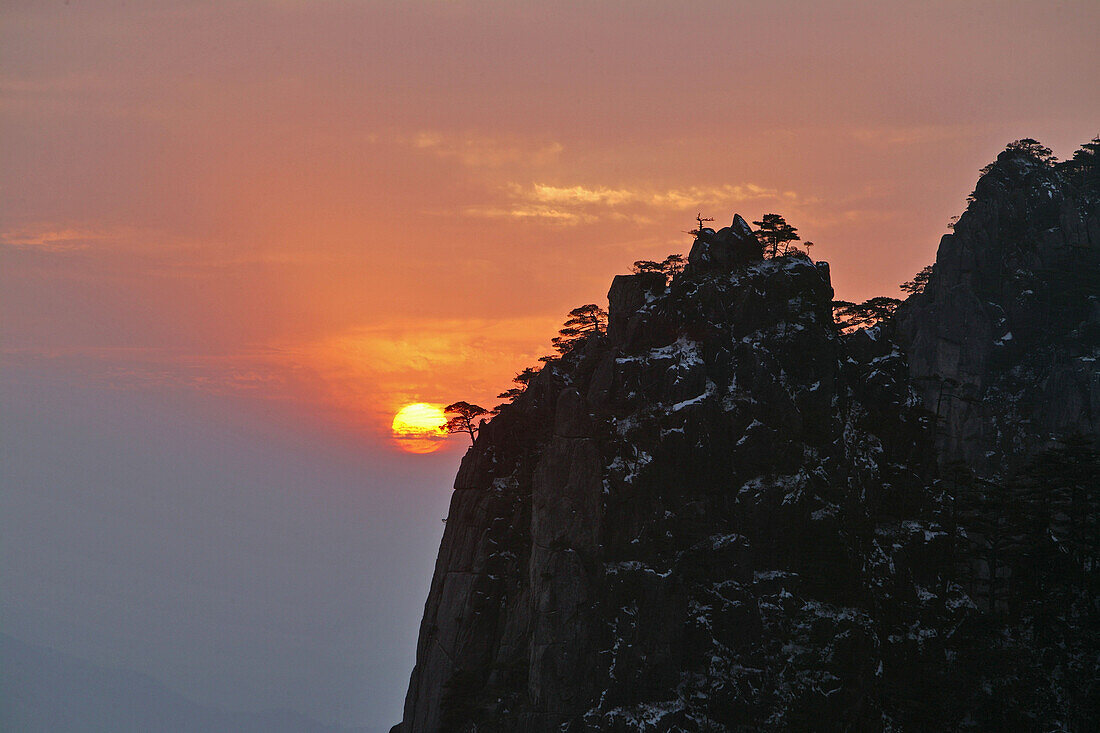 red sunset with mountain silhouette, Grand Canyon of Xihai, Huang Shan, World Heritage, UNESCO, Anhui province, China, Asia