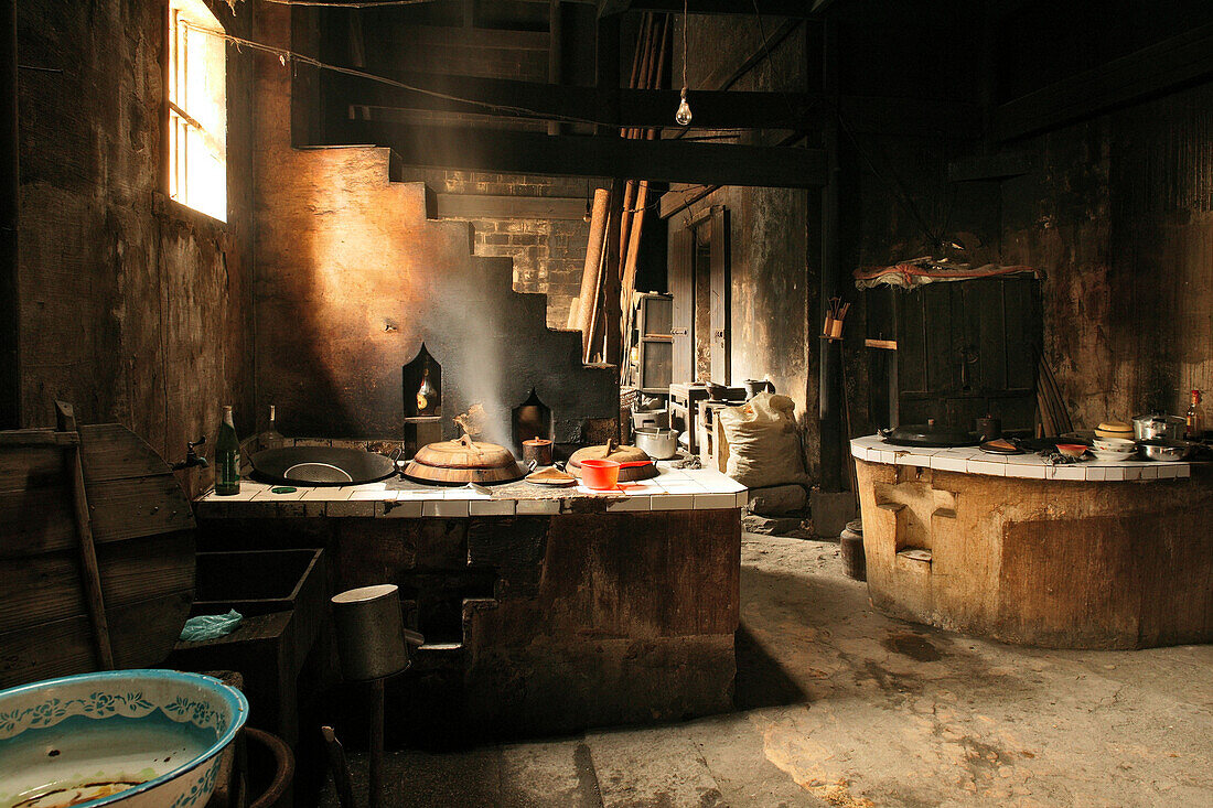 Interior view of a traditional kitchen in an old timber farmhouse, Chengkan near Huangshan, Anui, China, Asia