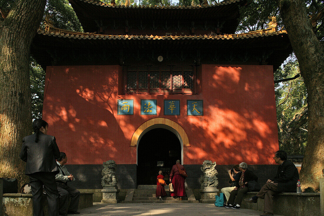 People in front of the red gate of the Fayu monastery, Putuo Shan Island, Zhejiang province, China, Asia