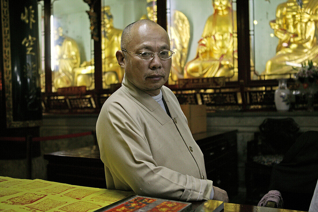 for a donation the pilgrims get a block print of the temple's name on their yellow bag, offical seal, Buddhist Island of Putuo Shan near Shanghai, Zhejiang Province, East China Sea, China, Asia