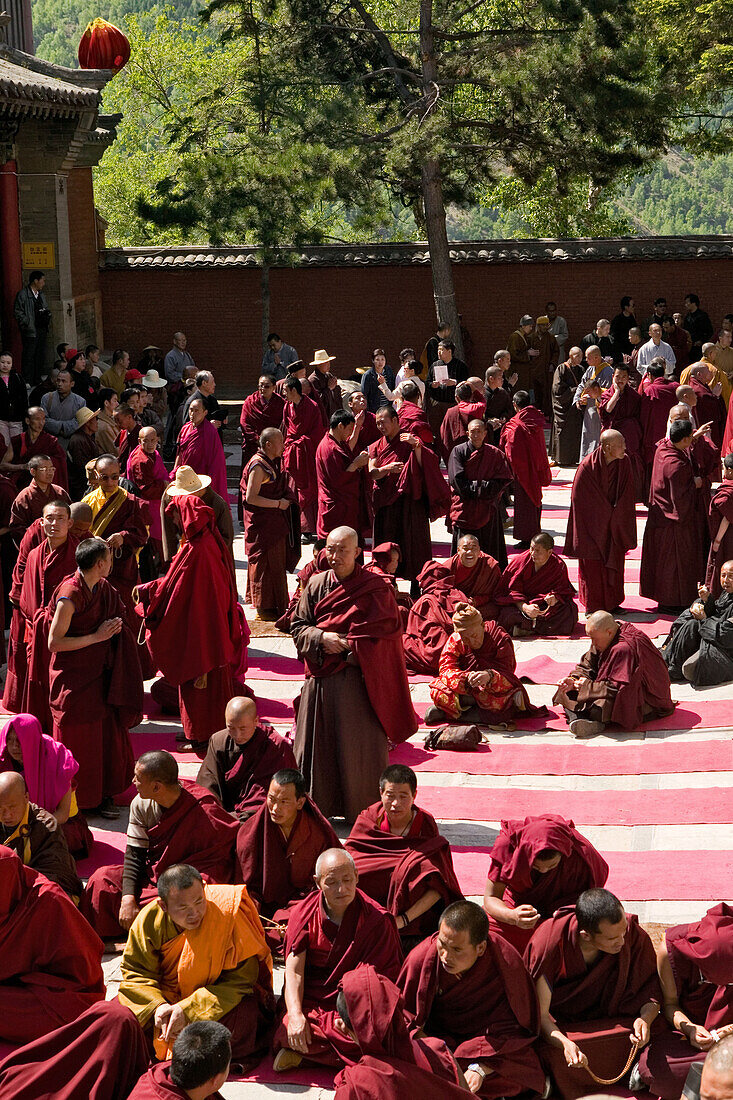 prayer ceremony, buddhist monks, court yard, during birthday of Wenshu, Xiantong Monastery, Wutai Shan, Five Terrace Mountain, Buddhist Centre, town of Taihuai, Shanxi province, China, Asia